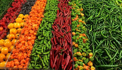 High angle view of various chili peppers for sale at market