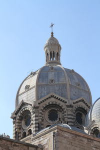 Low angle view of church against blue sky