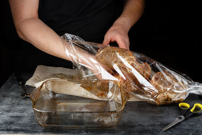 Midsection of man preparing food