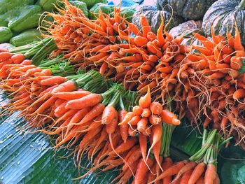 High angle view of orange vegetables in market