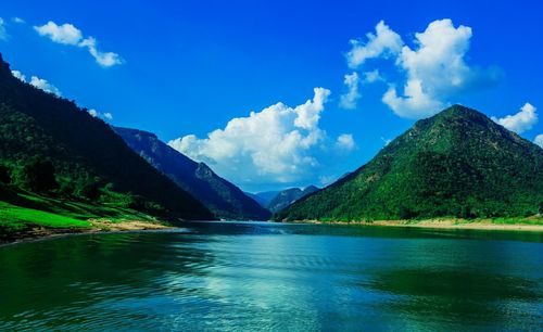 Scenic view of sea against cloudy sky