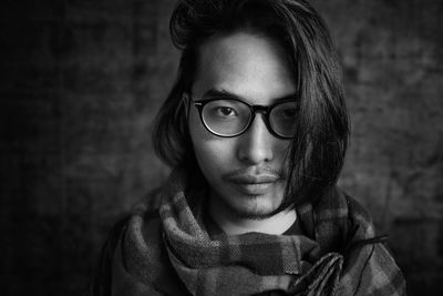 Close-up portrait of a serious young woman