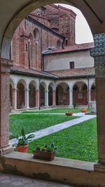 Potted plants in front of historic building