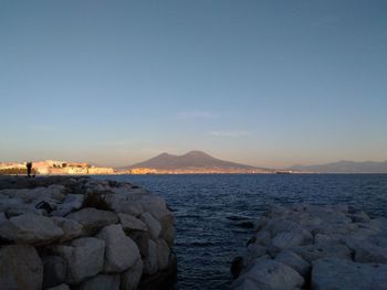 Scenic view of sea against clear sky during sunset