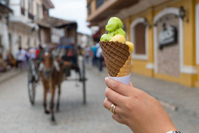 Hand holding ice cream cone