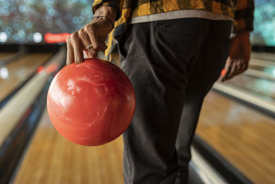 Man playing ten pin bowling