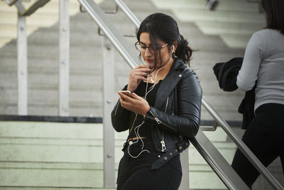 Young woman using cell phone