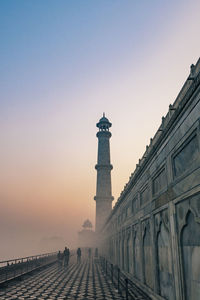 Taj mahal at foggy sunrise in winter