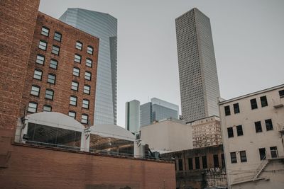 Low angle view of buildings against clear sky