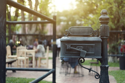 Close-up of metal bench in park