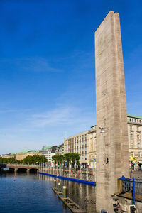 View of buildings against blue sky and clouds