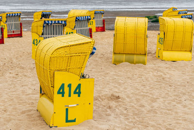 High angle view of yellow text on beach