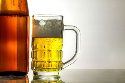 Close-up of beer glass on table