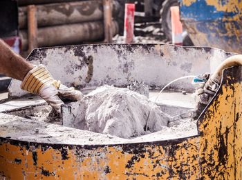 People working on metal structure