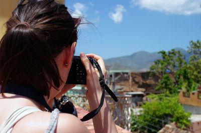 Portrait of woman against sky