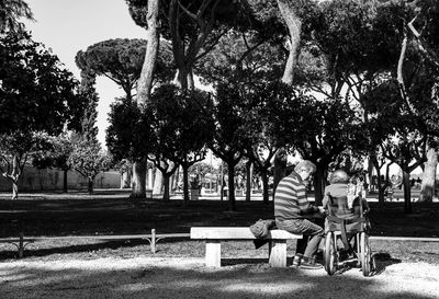 Man sitting on chair in park