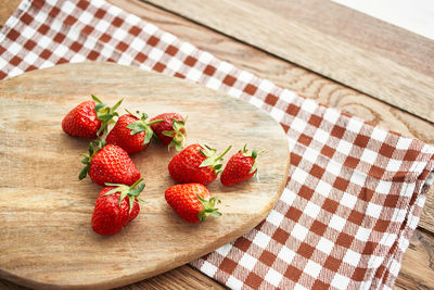 High angle view of strawberries on table