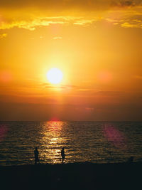 View of calm sea at sunset