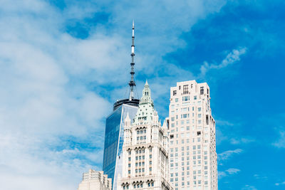 Low angle view of building against cloudy sky