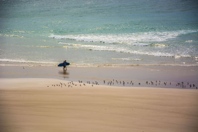 Scenic view of beach by sea