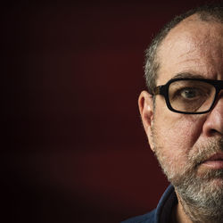Close-up portrait of a serious young man