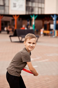 Portrait of boy playing outdoors