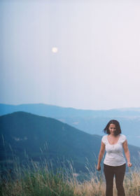 Full length of man standing on land against sky