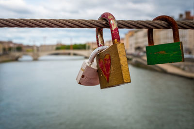 Close-up of padlocks on railing