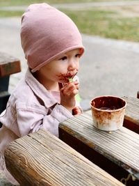 Close-up of girl eating food at table