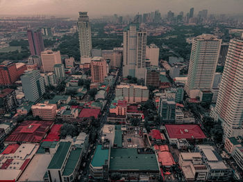 High angle view of modern buildings in city against sky