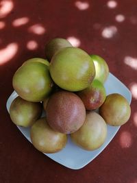 High angle view of fruits in plate on table