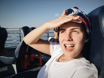 Portrait of young woman on a ferry rooftop