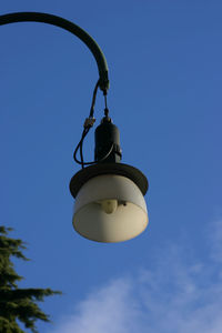 Low angle view of hanging against blue sky