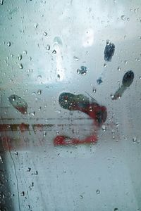 Full frame shot of raindrops on glass window