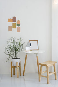 Table and chairs against wall at home