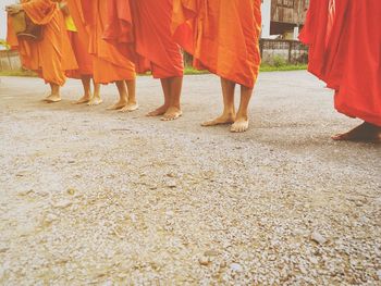 Low section of people walking in temple