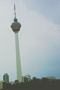 Low angle view of communications tower against sky