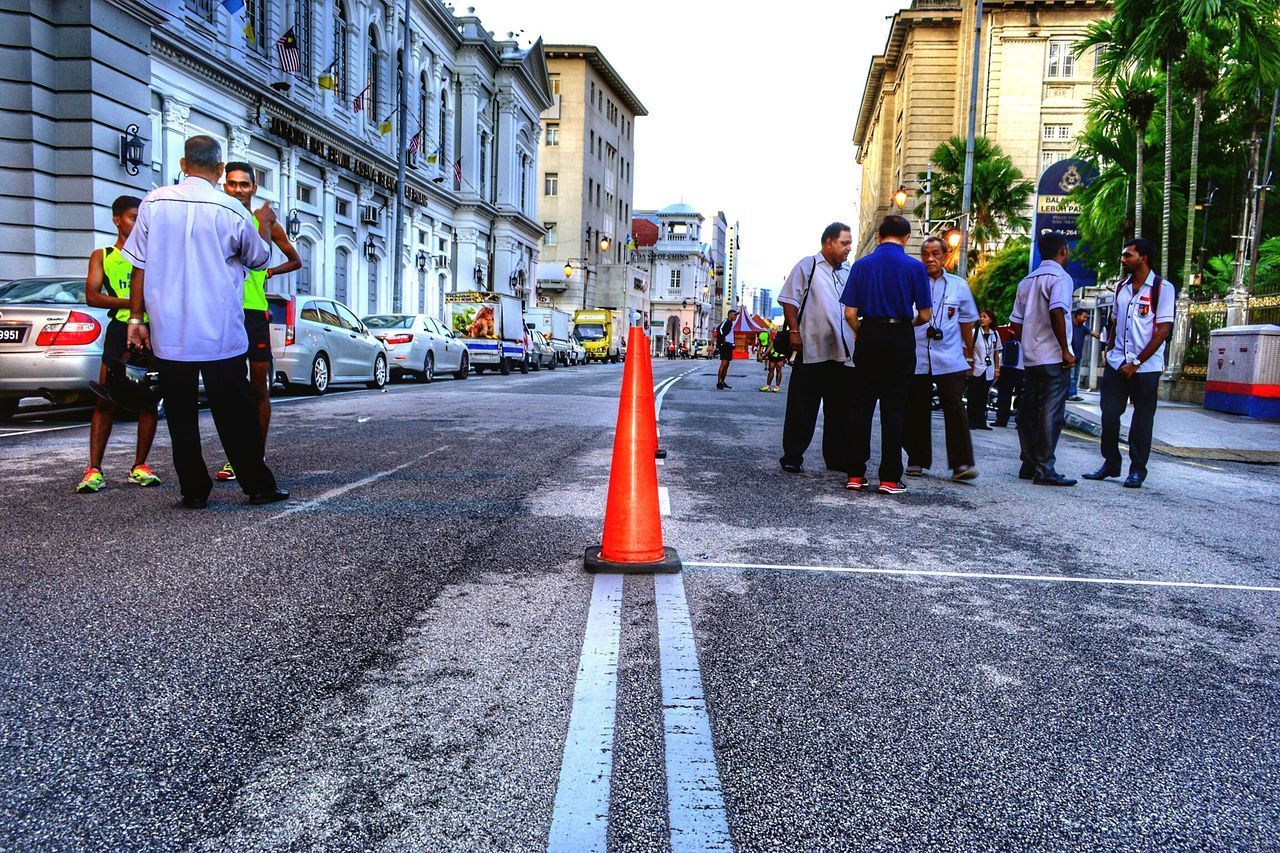 PEOPLE STANDING ON STREET