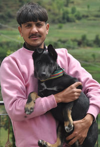 Portrait of man with dog