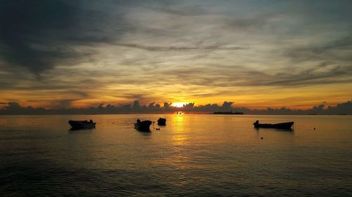 Scenic view of calm sea at sunset