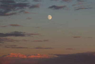 Scenic view of moon at sunset