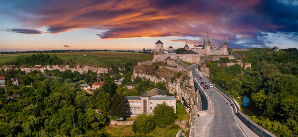 Aerial view of the romantic stone medievel castle on top of the mountain