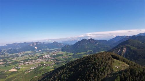 Scenic view of mountains against clear blue sky