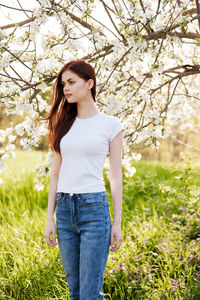 Young woman standing on field