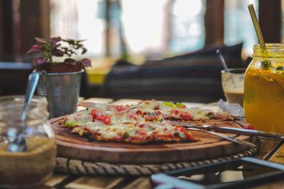 Close-up of pizza served on table