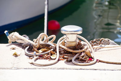 Close-up of rope tied on table