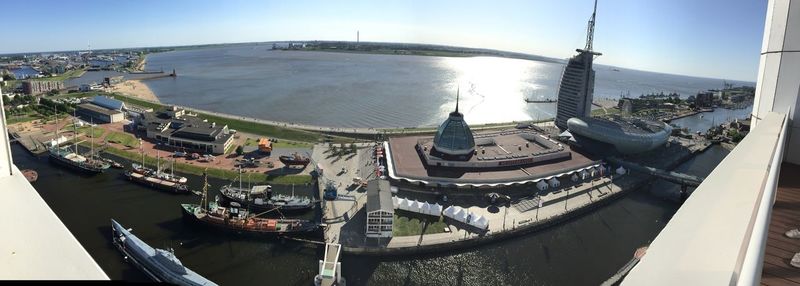 High angle view of boats moored in city against sky