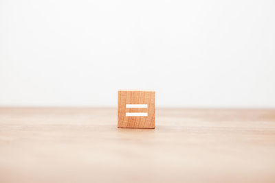 Close-up of dices on table against white background