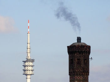 Smoke emitting from chimney against clear sky