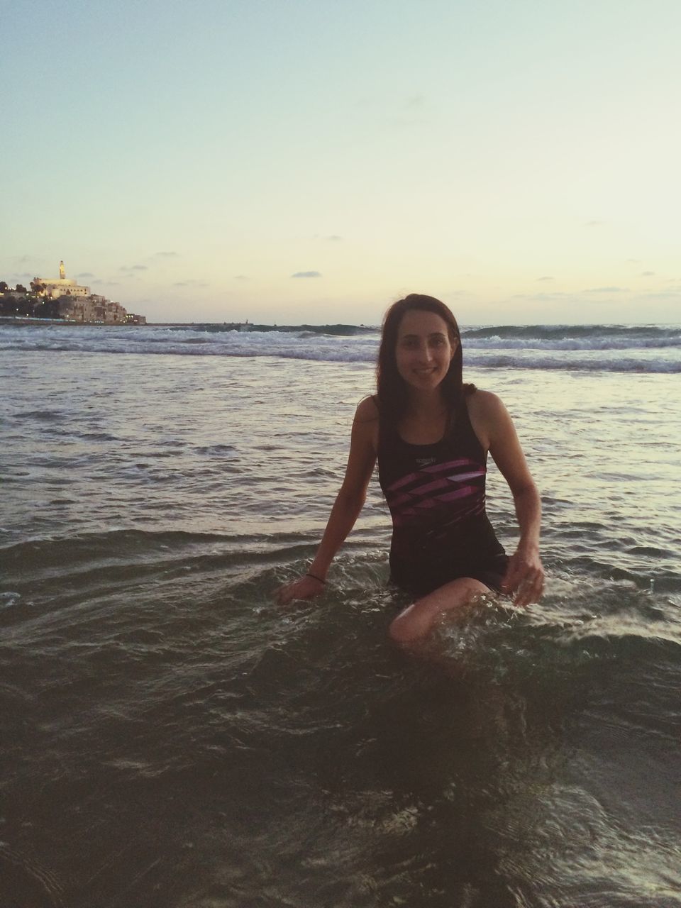 water, sea, person, lifestyles, leisure activity, looking at camera, portrait, beach, young adult, casual clothing, full length, horizon over water, shore, happiness, young women, smiling, standing, childhood